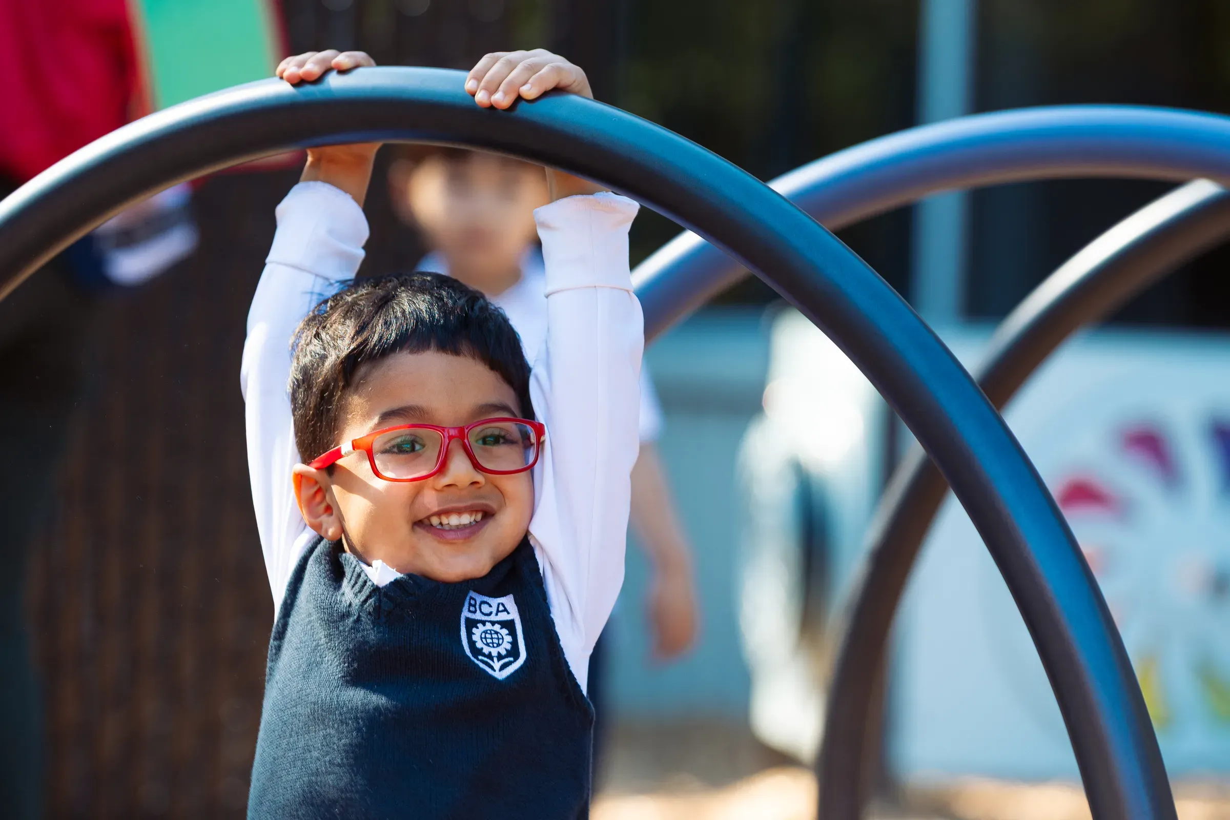 Classroom moment — student smiling during a learning activity