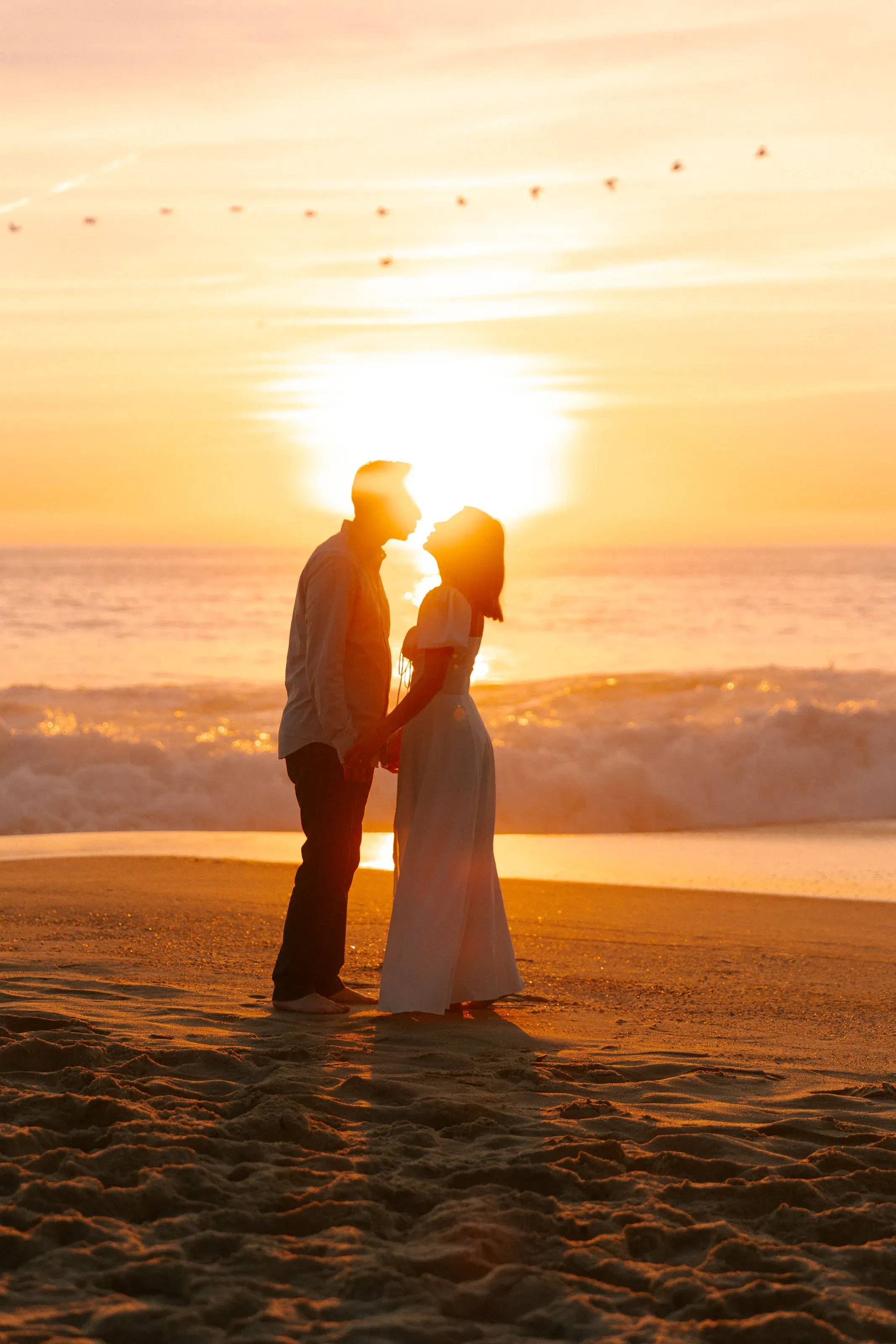 Sunset kiss photographed at the waterline