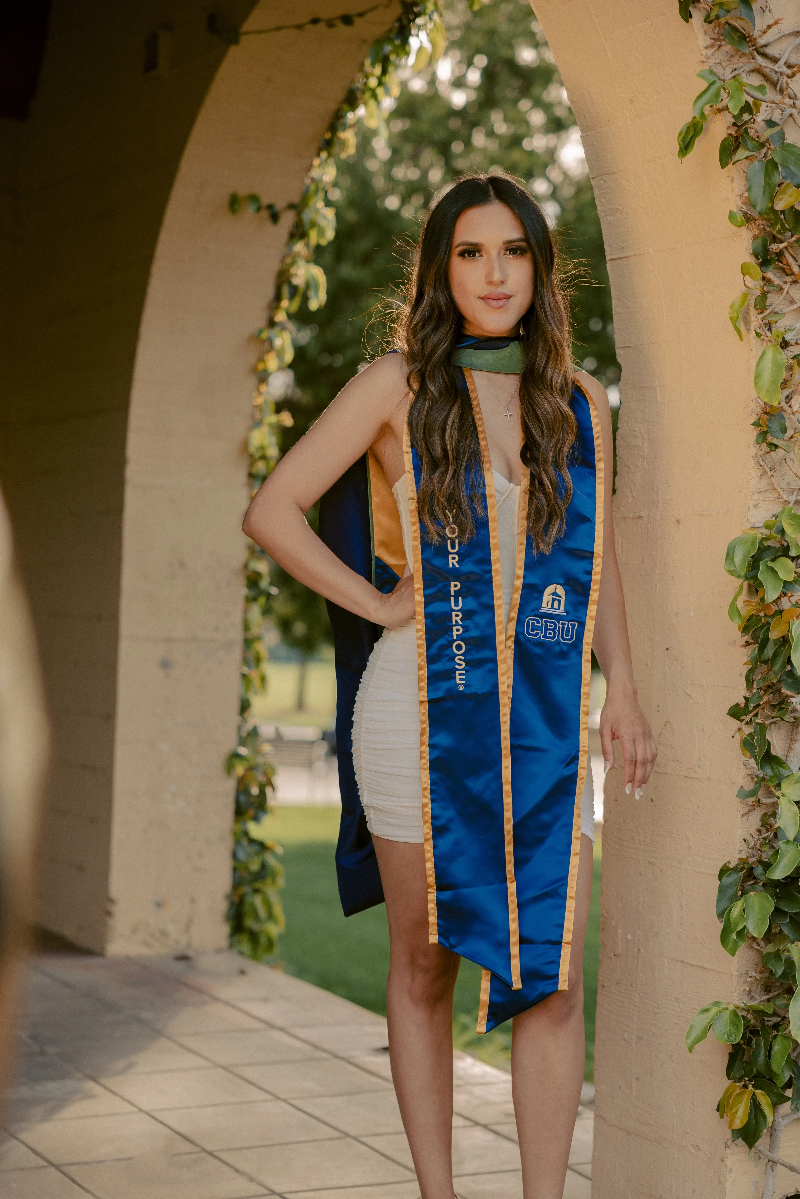 UCLA graduate wearing her blue and gold commencement stole