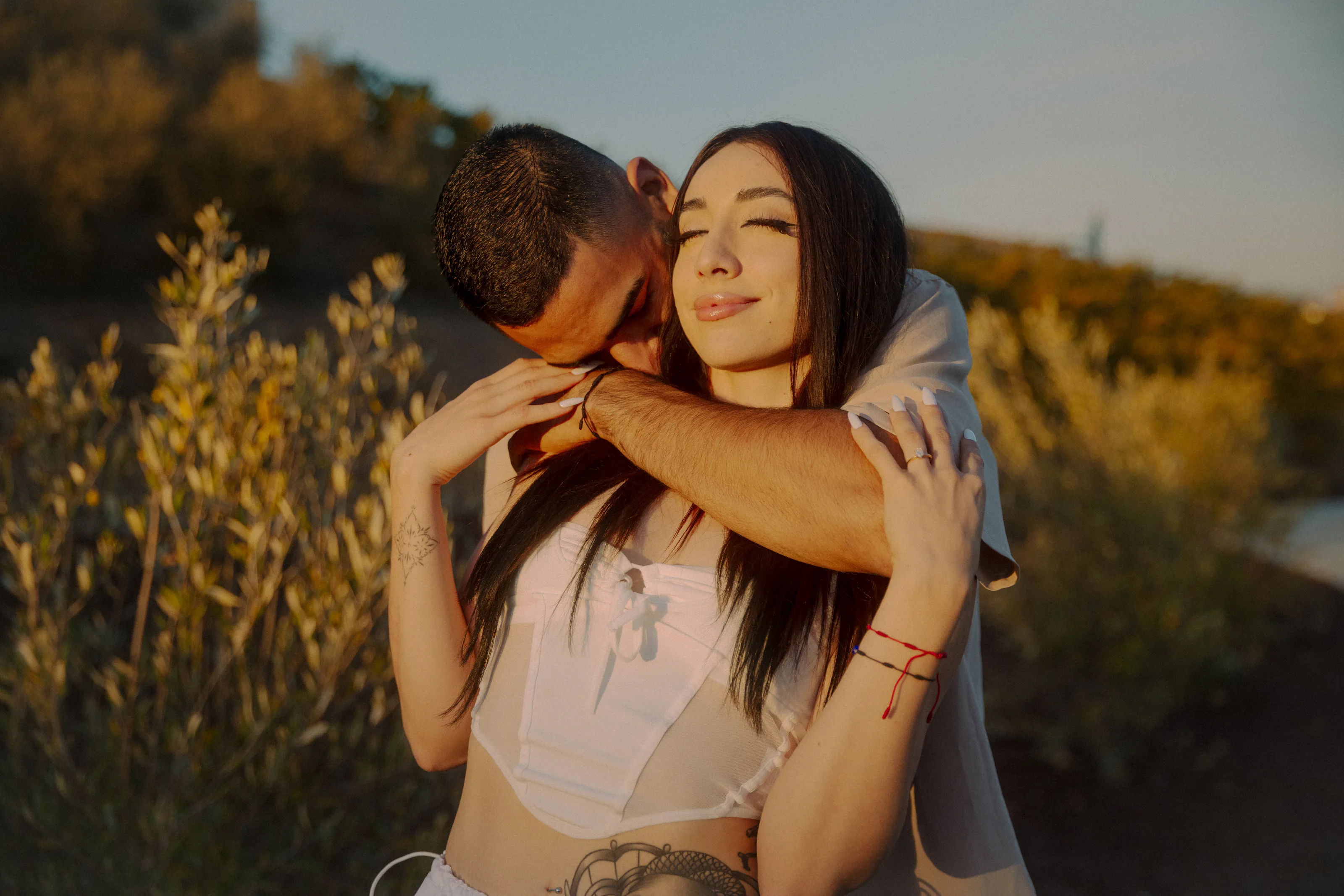 Newly engaged couple embracing after the proposal