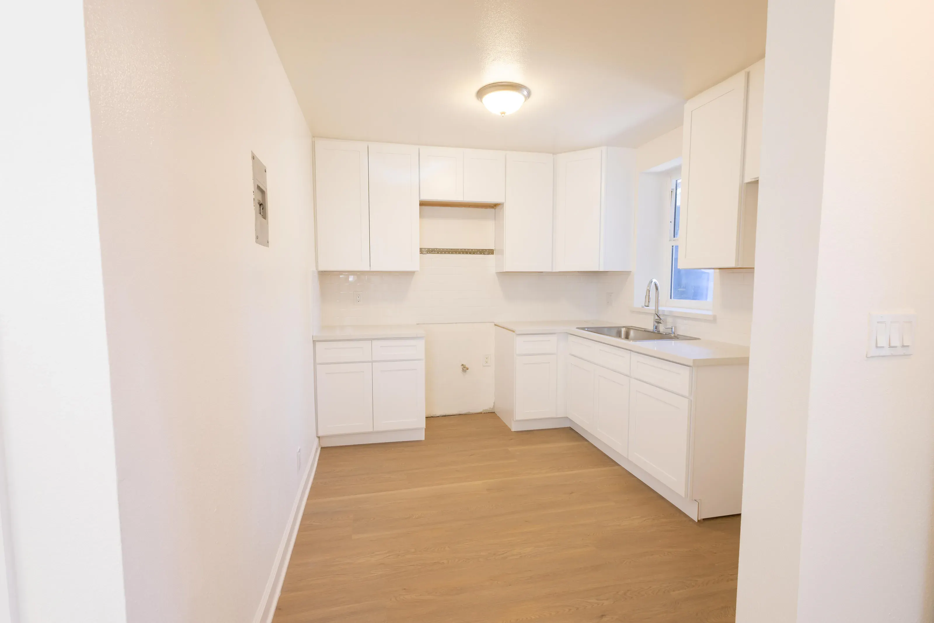 Wide kitchen and dining view showing the layout of the home