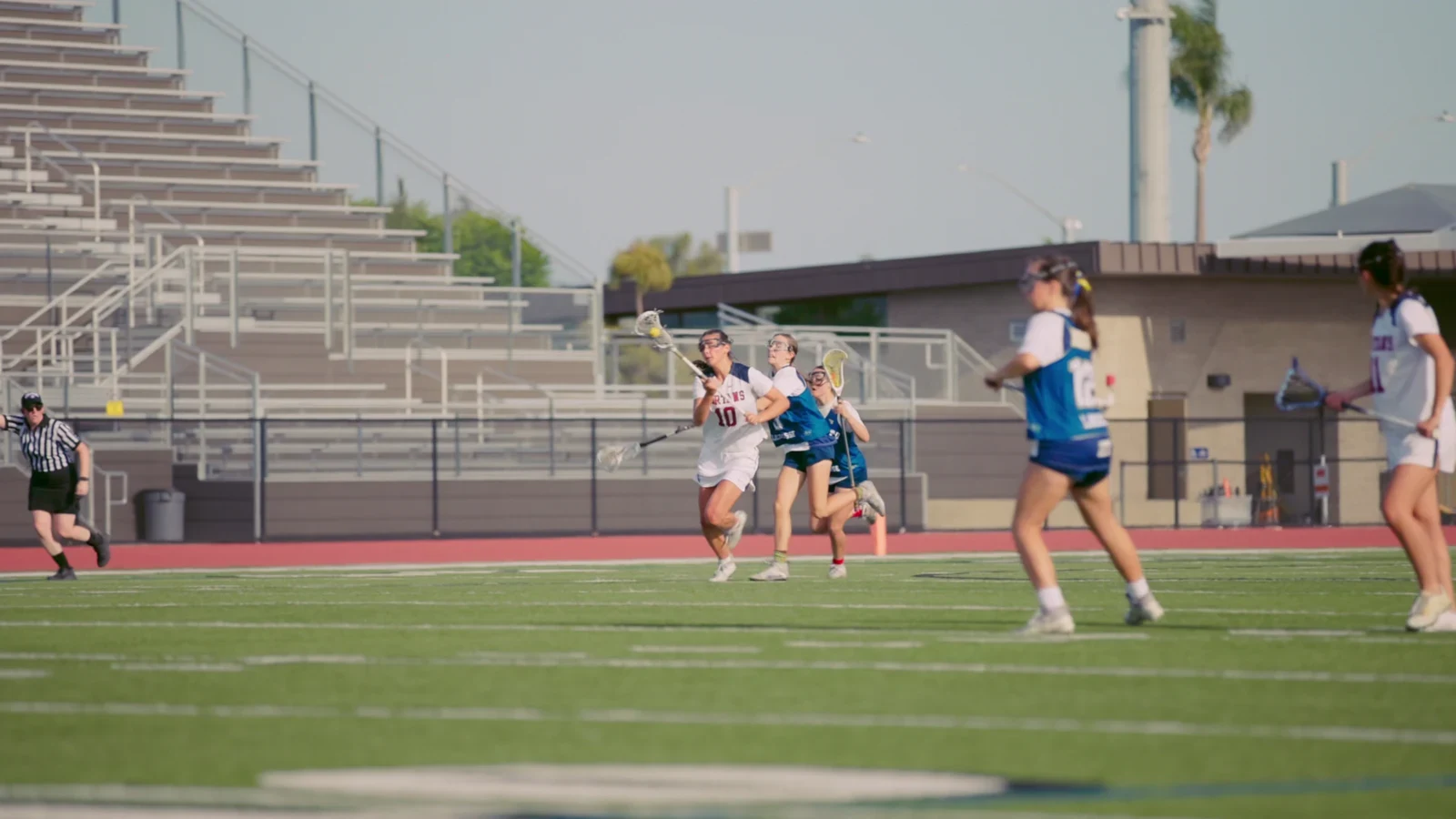 St. Margaret’s girls lacrosse players competing on the field