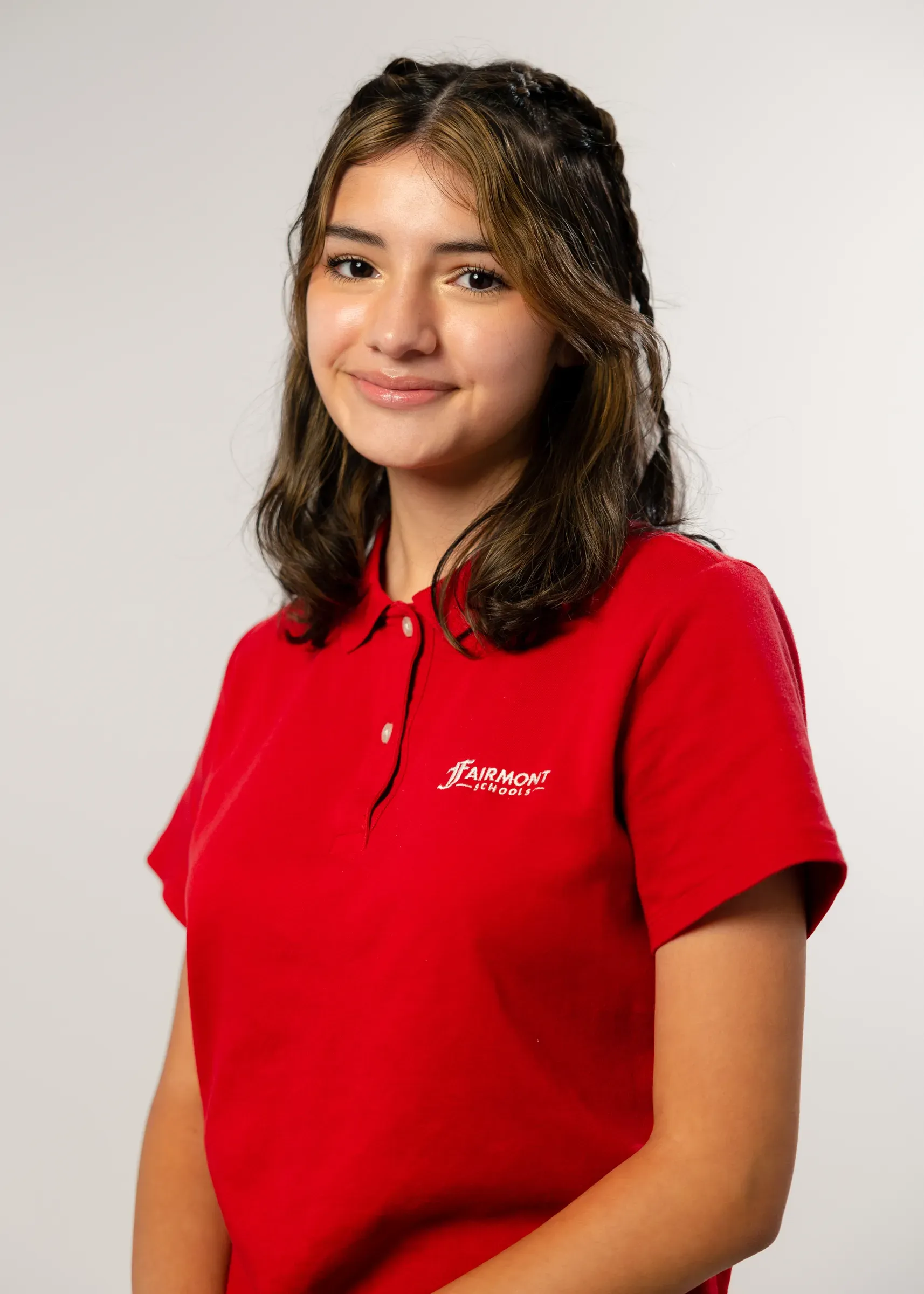 Picture Day portrait of a student in a red shirt against a neutral backdrop