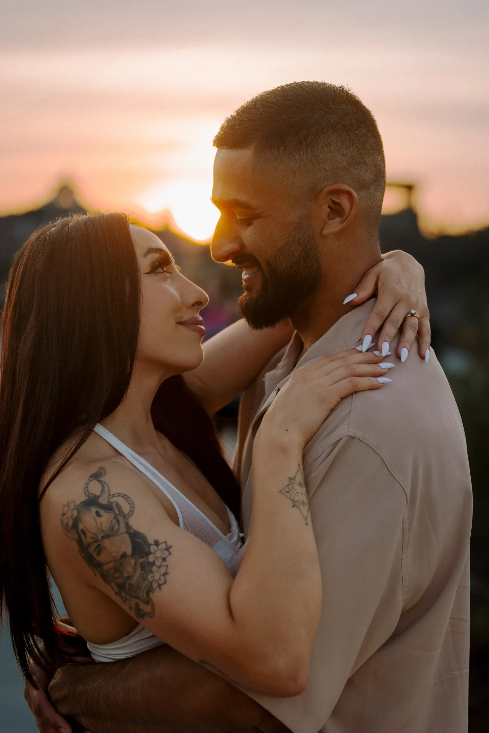 Golden-hour embrace between partners