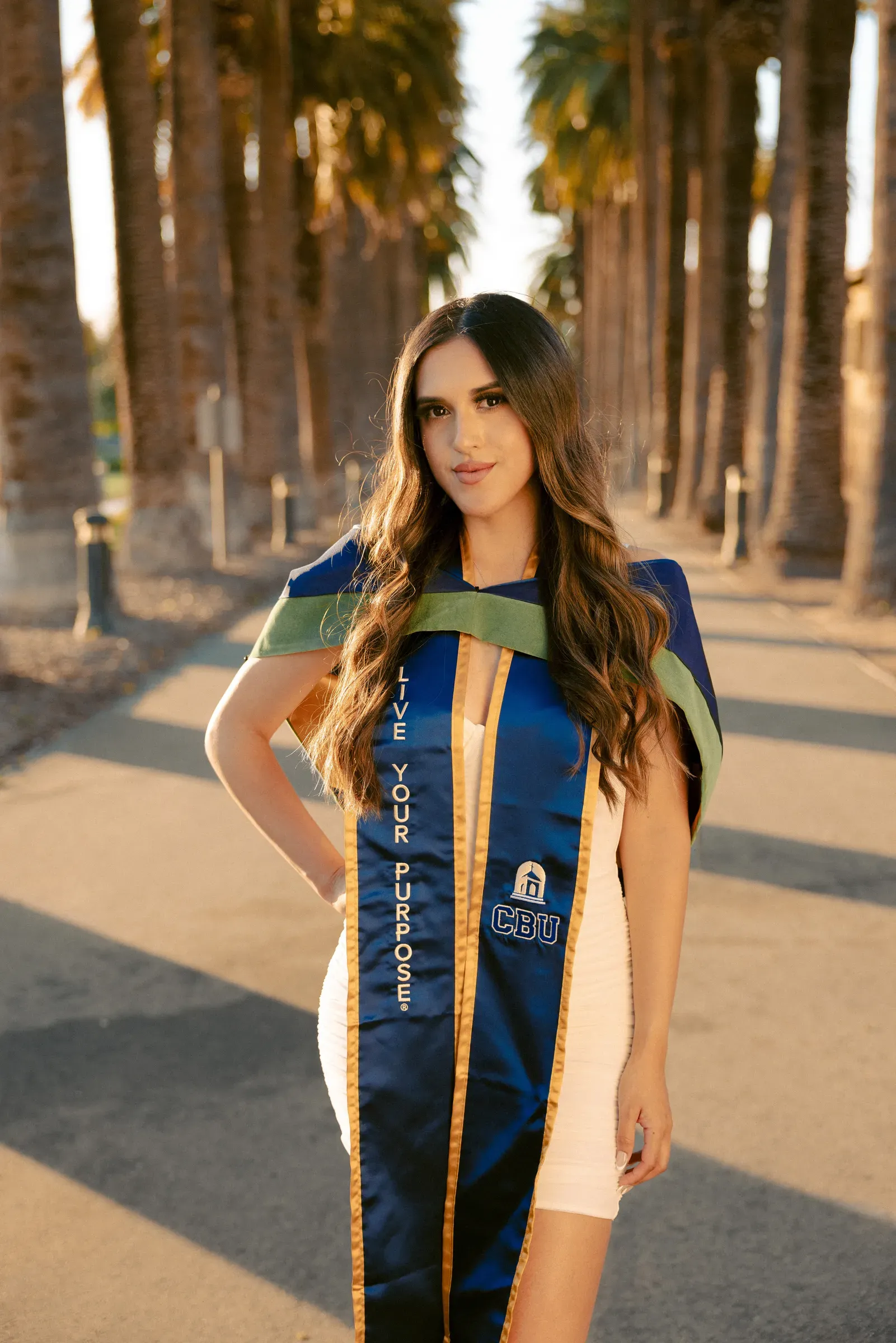 Graduate portrait among Southern California palm trees
