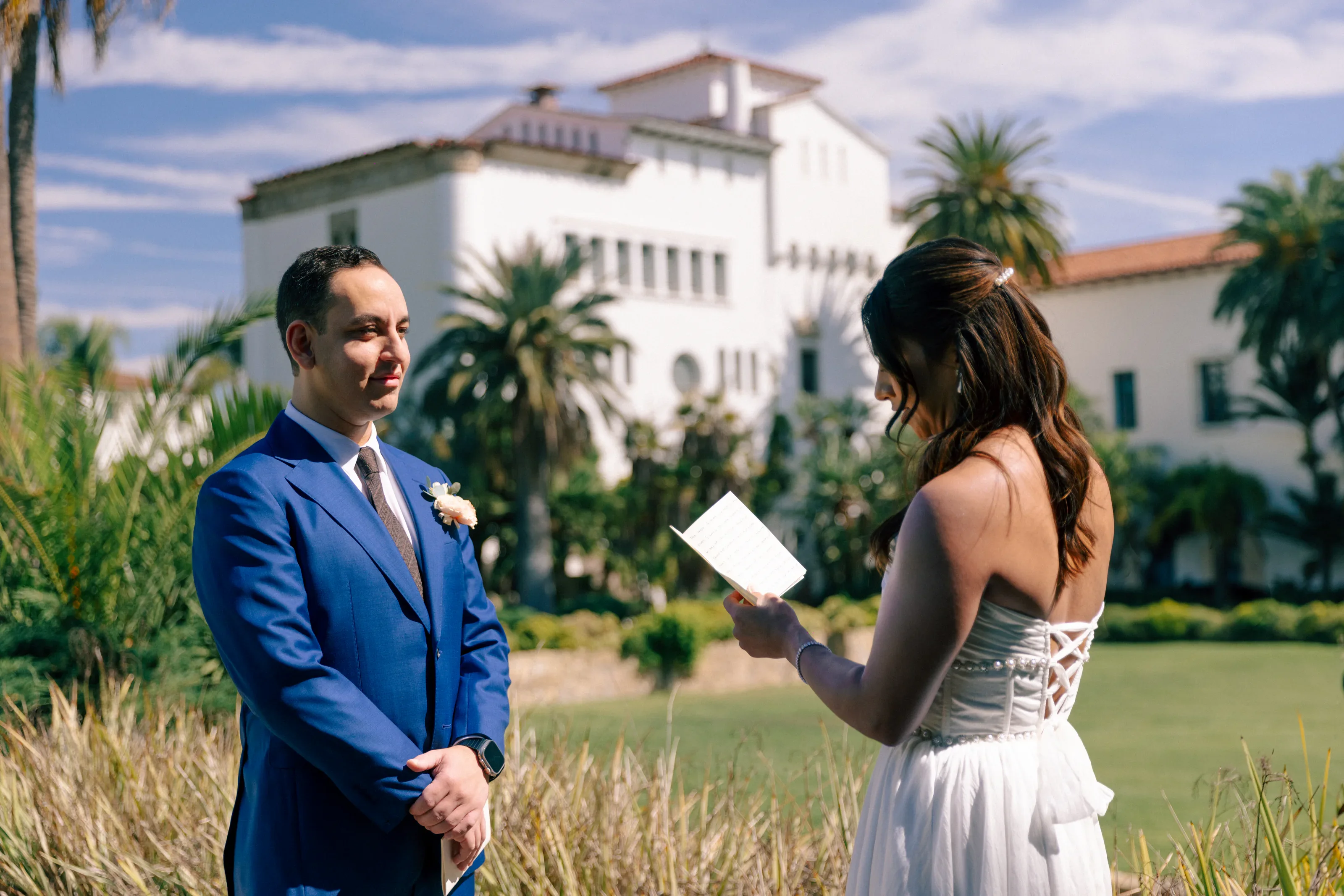 Laura and Daneil exchanging vows outdoors in Santa Barbara